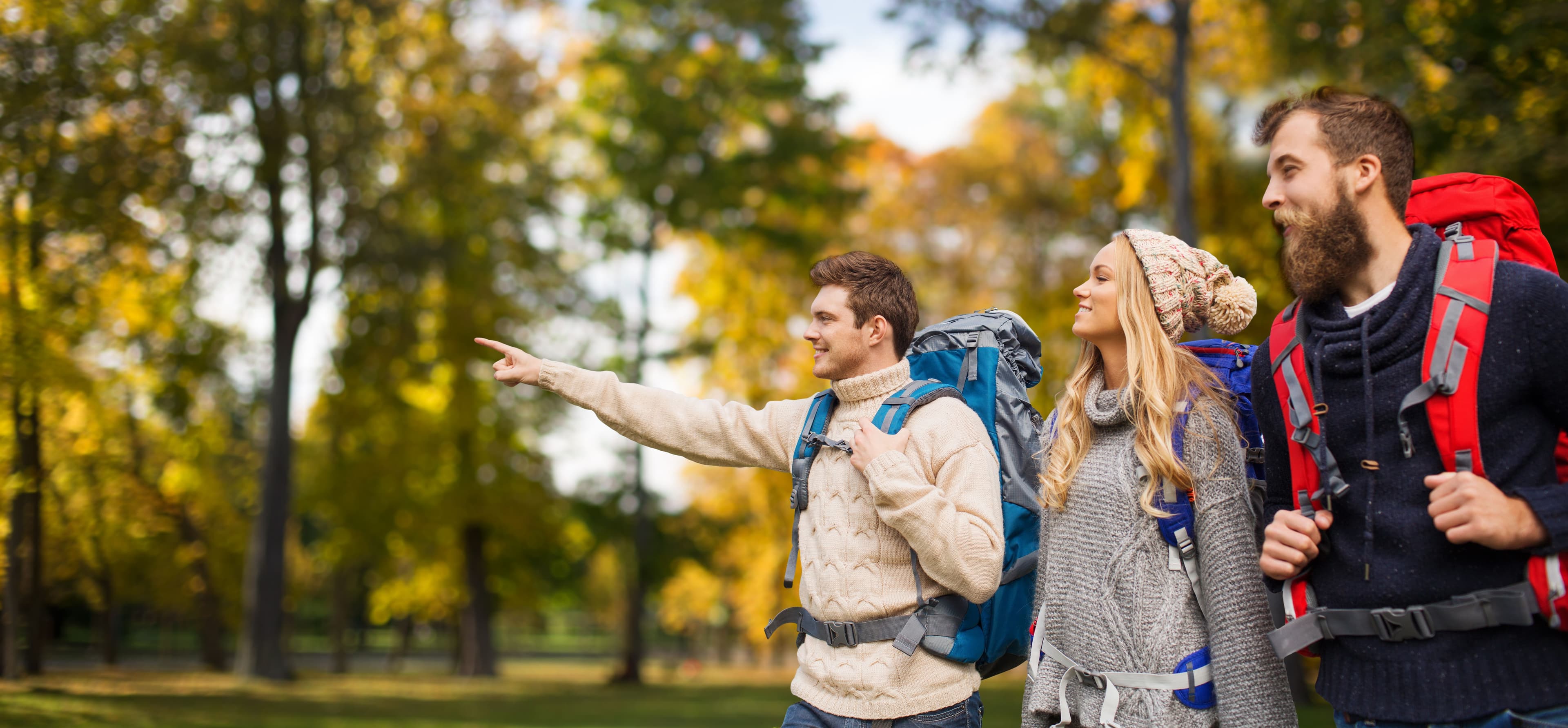 adventure_travel_tourism_hike_people_concept_group_smiling_friends_walking_with_backpacks_natural_background_f88c19c637.jpg